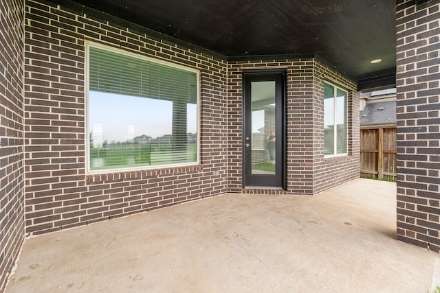 view of patio / terrace featuring fence