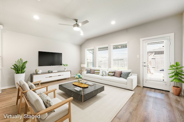 7438 Victoria Brook Trce, Richmond, TX 77407 - living room with light wood finished floors, ceiling fan, lofted ceiling, recessed lighting, and baseboards