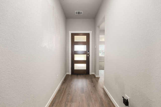 7438 Victoria Brook Trce, Richmond, TX 77407 - entryway with dark wood finished floors, a textured wall, and baseboards