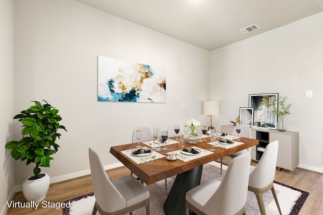 7438 Victoria Brook Trce, Richmond, TX 77407 - dining space featuring light wood-type flooring and baseboards
