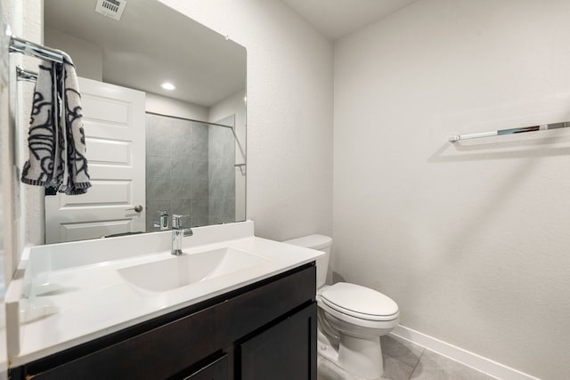 7438 Victoria Brook Trce, Richmond, TX 77407 - full bathroom featuring toilet, vanity, tile patterned flooring, a tile shower, and baseboards
