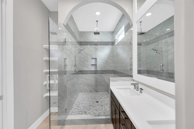 1215 W 23rd St, Houston, TX 77008 - bathroom with vanity, a shower stall, recessed lighting, and baseboards