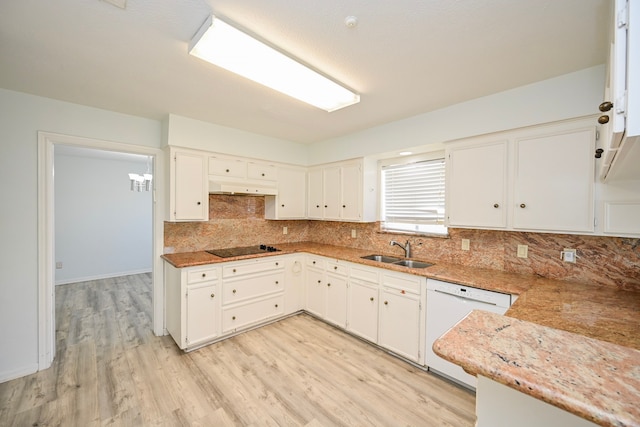 7735 Quail Meadow Dr, Houston, TX 77071 - kitchen with dishwasher, under cabinet range hood, black electric stovetop, light wood-type flooring, and decorative backsplash
