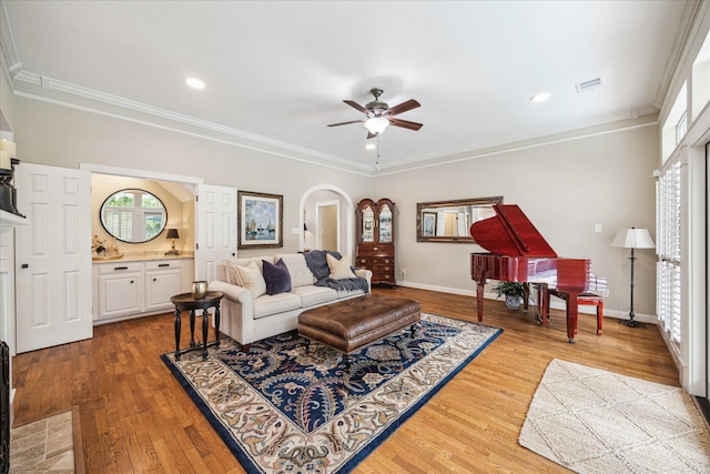51 Dartmoor Ct, Sugar Land, TX 77479 - living room with ceiling fan, wood finished floors, ornamental molding, baseboards, and recessed lighting