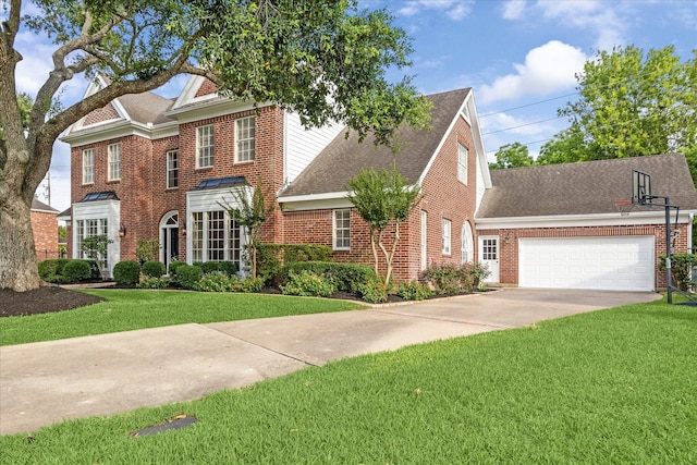 51 Dartmoor Ct, Sugar Land, TX 77479 - colonial inspired home featuring a shingled roof, a front yard, an attached garage, and brick siding