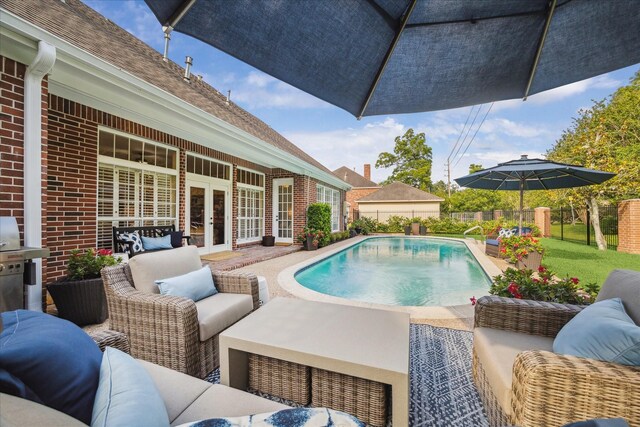 51 Dartmoor Ct, Sugar Land, TX 77479 - view of swimming pool with french doors, an outdoor living space, a patio area, and grilling area
