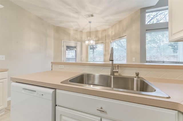 12950 Quail Park Dr, Cypress, TX 77429 - kitchen with dishwasher, white cabinetry, light countertops, and pendant lighting