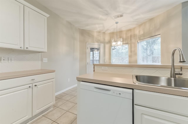 12950 Quail Park Dr, Cypress, TX 77429 - kitchen featuring white dishwasher, a sink, decorative backsplash, and healthy amount of natural light