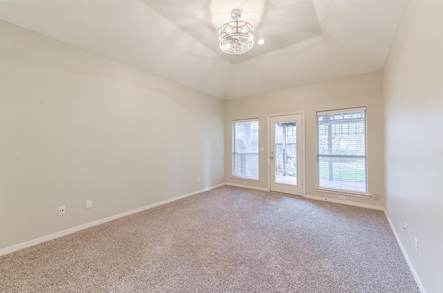 12950 Quail Park Dr, Cypress, TX 77429 - empty room featuring carpet flooring, a chandelier, and baseboards