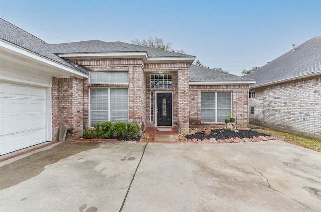 12950 Quail Park Dr, Cypress, TX 77429 - property entrance with brick siding and a shingled roof