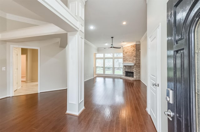 12950 Quail Park Dr, Cypress, TX 77429 - unfurnished living room with a fireplace, a ceiling fan, wood finished floors, ornamental molding, and recessed lighting