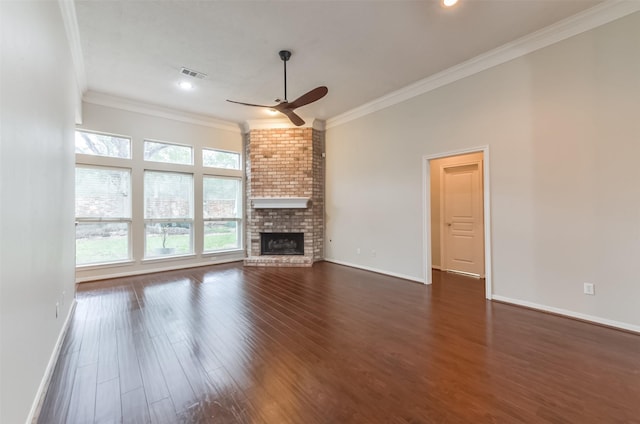 12950 Quail Park Dr, Cypress, TX 77429 - unfurnished living room with a ceiling fan, dark wood-style floors, crown molding, a brick fireplace, and recessed lighting