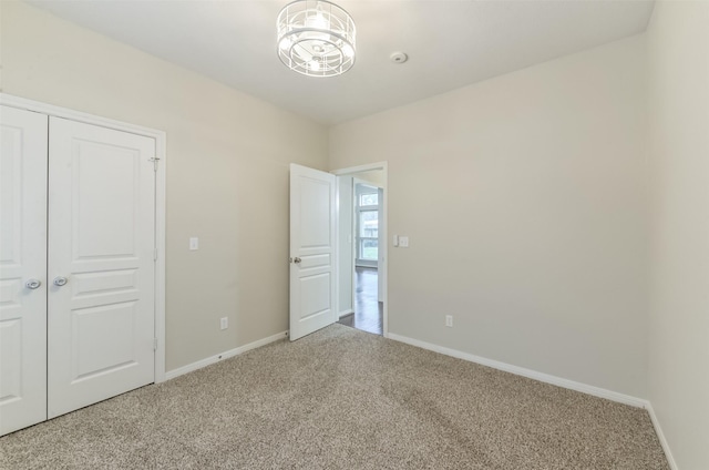 12950 Quail Park Dr, Cypress, TX 77429 - unfurnished bedroom featuring carpet floors, baseboards, and a closet