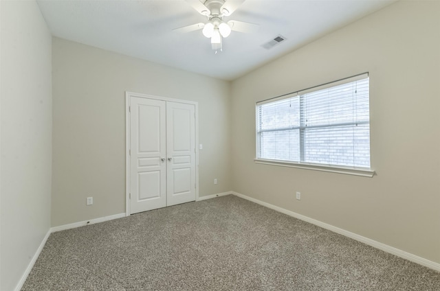 12950 Quail Park Dr, Cypress, TX 77429 - unfurnished bedroom with carpet flooring, a closet, baseboards, and ceiling fan