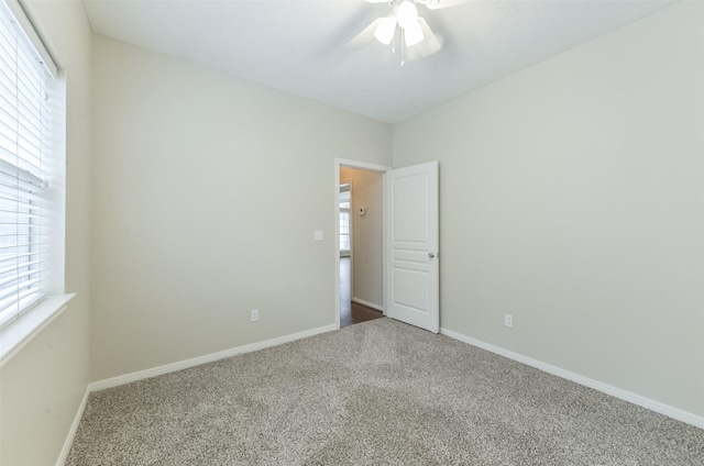 12950 Quail Park Dr, Cypress, TX 77429 - empty room featuring carpet flooring, ceiling fan, and baseboards
