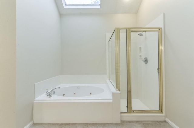 12950 Quail Park Dr, Cypress, TX 77429 - full bathroom with a skylight, a whirlpool tub, a stall shower, and baseboards