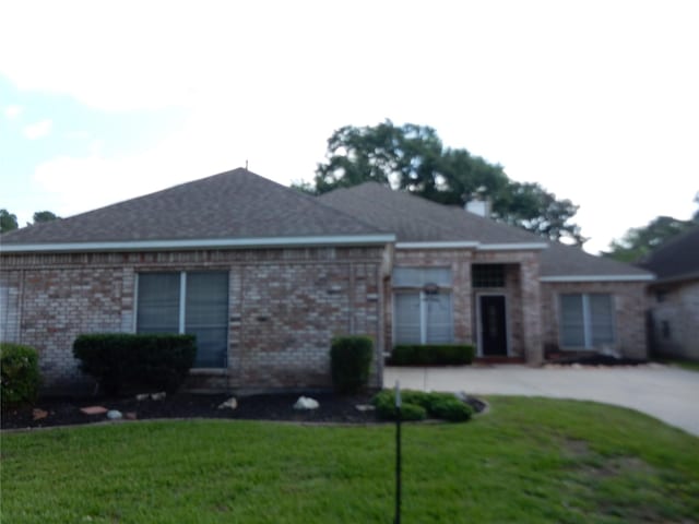 12950 Quail Park Dr, Cypress, TX 77429 - single story home featuring a front lawn, brick siding, and concrete driveway