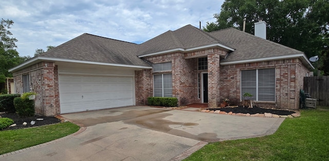 12950 Quail Park Dr, Cypress, TX 77429 - view of front facade featuring brick siding, concrete driveway, an attached garage, a chimney, and a shingled roof