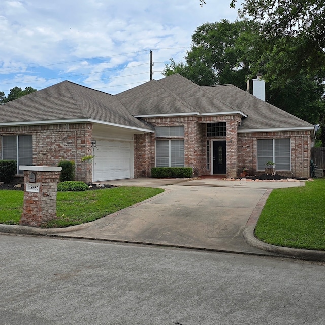 12950 Quail Park Dr, Cypress, TX 77429 - view of front of property with brick siding, a chimney, a garage, and a front lawn