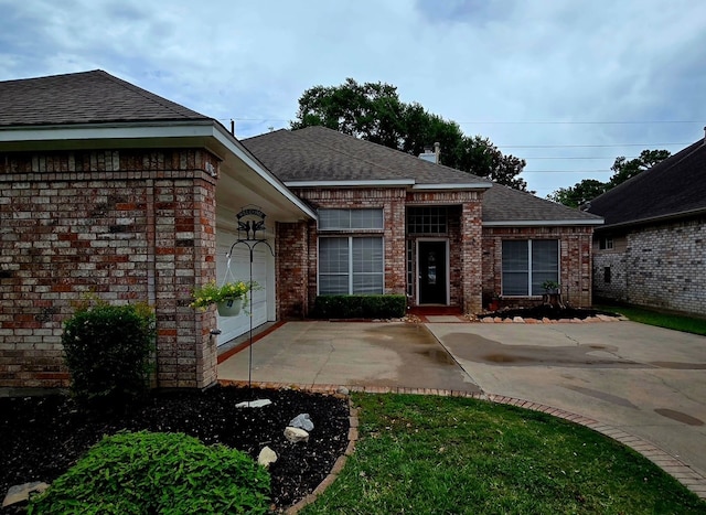 12950 Quail Park Dr, Cypress, TX 77429 - view of front of home featuring brick siding, roof with shingles, and an attached garage