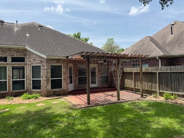 12950 Quail Park Dr, Cypress, TX 77429 - rear view of house with a pergola, roof with shingles, brick siding, and a patio area