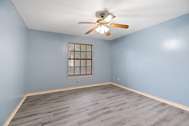 12923 Hunterfield Dr, Cypress, TX 77429 - empty room with ceiling fan, wood finished floors, and baseboards