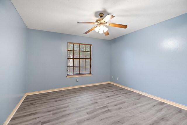 12923 Hunterfield Dr, Cypress, TX 77429 - unfurnished room with ceiling fan, wood finished floors, and baseboards