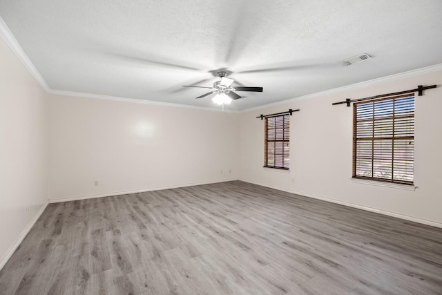 12923 Hunterfield Dr, Cypress, TX 77429 - empty room with wood finished floors, a ceiling fan, a textured ceiling, baseboards, and crown molding