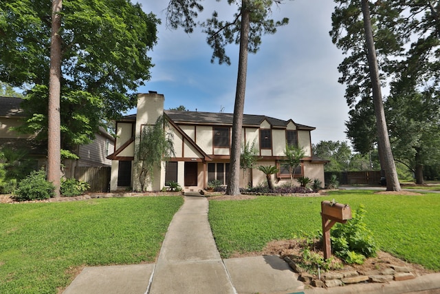 12923 Hunterfield Dr, Cypress, TX 77429 - view of front of house featuring a chimney and stucco siding
