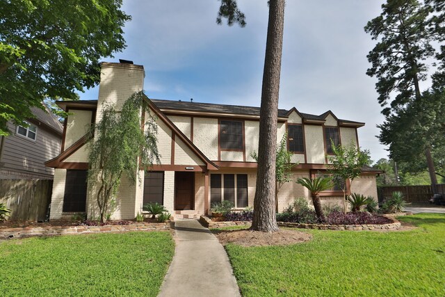 12923 Hunterfield Dr, Cypress, TX 77429 - english style home with a chimney, brick siding, and stucco siding