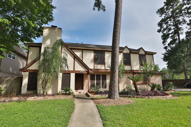12923 Hunterfield Dr, Cypress, TX 77429 - english style home with a chimney, brick siding, and stucco siding