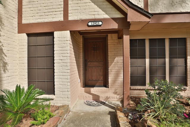 12923 Hunterfield Dr, Cypress, TX 77429 - view of exterior entry featuring brick siding