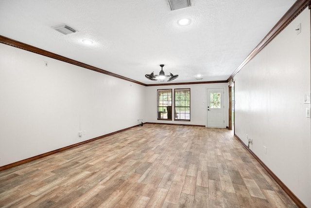 12923 Hunterfield Dr, Cypress, TX 77429 - spare room with ceiling fan, crown molding, baseboards, and light wood-type flooring