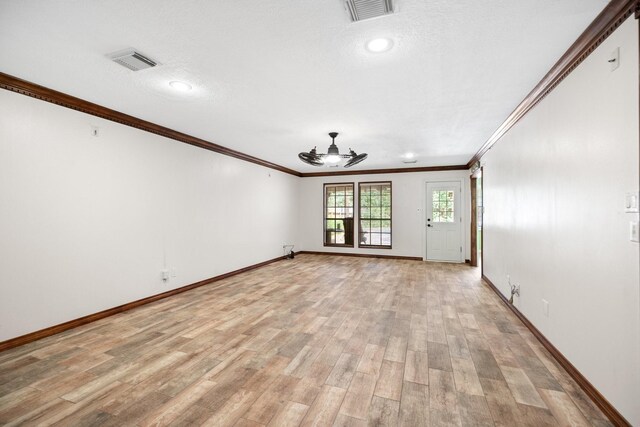 12923 Hunterfield Dr, Cypress, TX 77429 - empty room featuring a ceiling fan, ornamental molding, baseboards, and light wood-style flooring