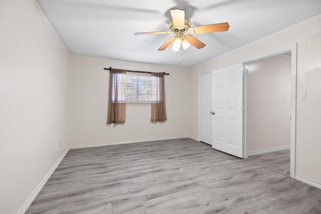 12923 Hunterfield Dr, Cypress, TX 77429 - unfurnished bedroom featuring wood finished floors, baseboards, a closet, and ceiling fan