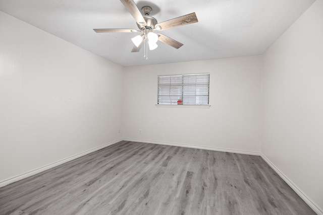 12923 Hunterfield Dr, Cypress, TX 77429 - spare room with wood finished floors, baseboards, and ceiling fan