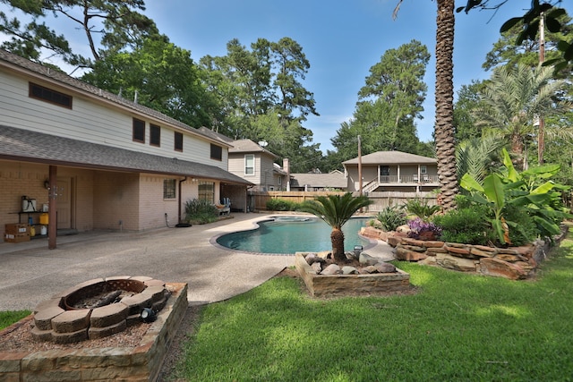 12923 Hunterfield Dr, Cypress, TX 77429 - view of swimming pool featuring an outdoor fire pit and a patio