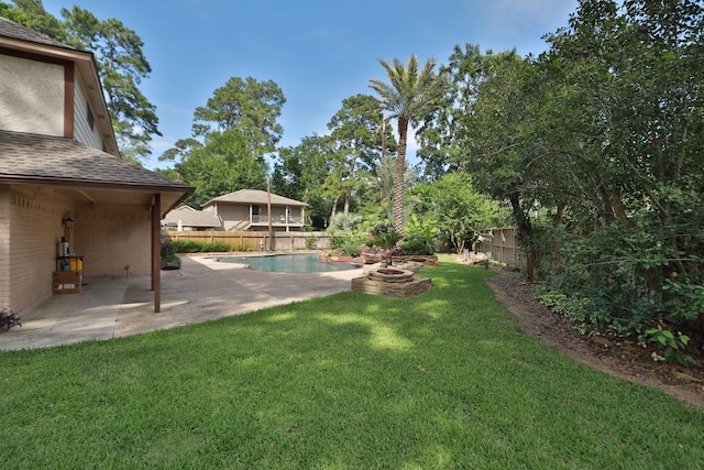 12923 Hunterfield Dr, Cypress, TX 77429 - view of yard with a patio and an outdoor fire pit