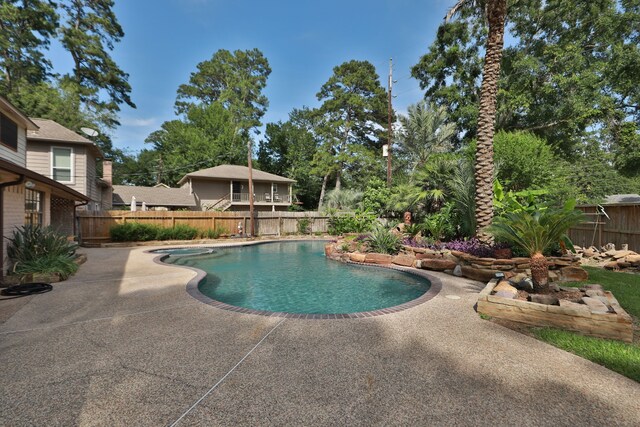 12923 Hunterfield Dr, Cypress, TX 77429 - view of swimming pool featuring a patio and a fenced backyard