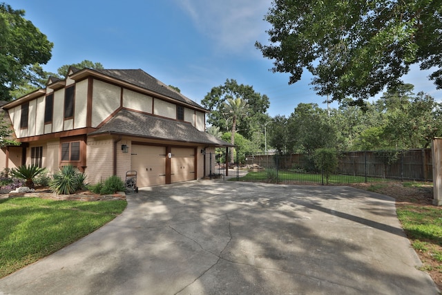 12923 Hunterfield Dr, Cypress, TX 77429 - view of home's exterior featuring brick siding, concrete driveway, a garage, and fence