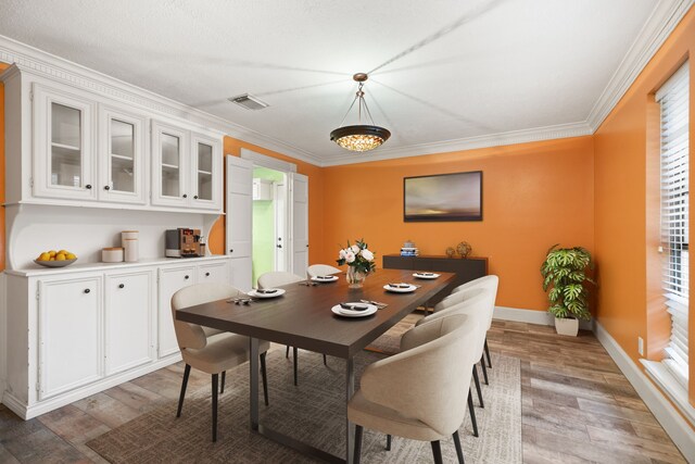 12923 Hunterfield Dr, Cypress, TX 77429 - dining space with light wood-style flooring, ornamental molding, and baseboards