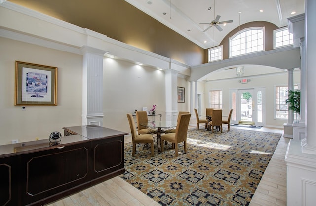 2111 Welch St Unit A110, Houston, TX 77019 - dining room with decorative columns, ceiling fan, wood finished floors, high vaulted ceiling, and arched walkways