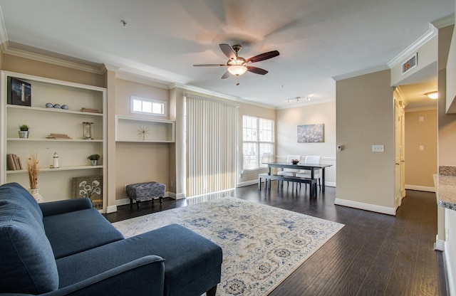 2111 Welch St Unit A110, Houston, TX 77019 - living room with ornamental molding, a ceiling fan, dark wood finished floors, baseboards, and built in shelves