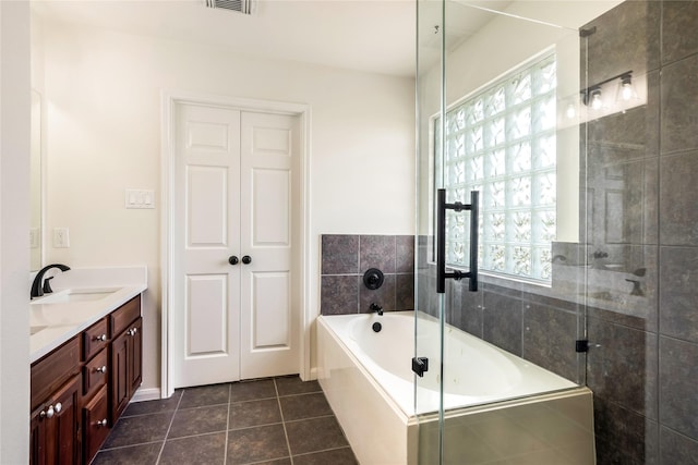 11818 Remington Run Ln, Houston, TX 77066 - full bathroom with healthy amount of natural light, a garden tub, tile patterned flooring, and tiled shower