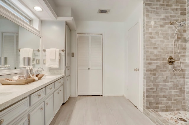 6202 Arcadian Shores Dr, Houston, TX 77084 - bathroom with a closet, a tile shower, and vanity