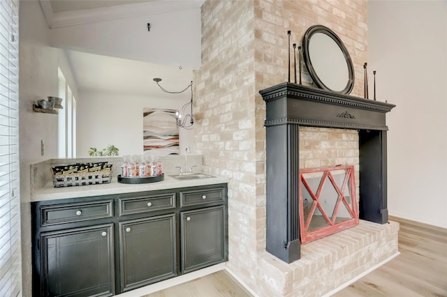 6202 Arcadian Shores Dr, Houston, TX 77084 - bar with light wood finished floors, a sink, and crown molding