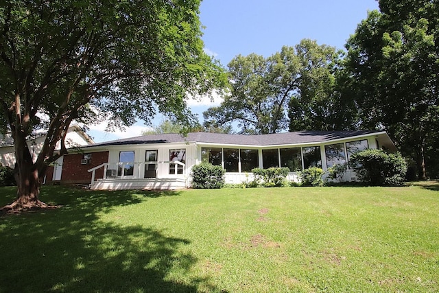 606 County Road 1947, Yantis, TX 75497 - rear view of property featuring a lawn