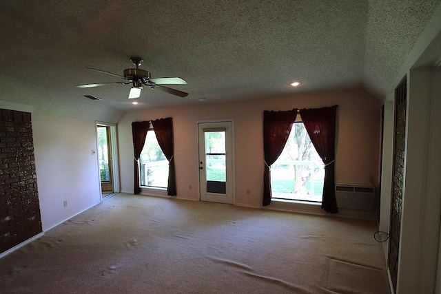 606 County Road 1947, Yantis, TX 75497 - carpeted spare room featuring a ceiling fan, a textured ceiling, baseboards, recessed lighting, and vaulted ceiling