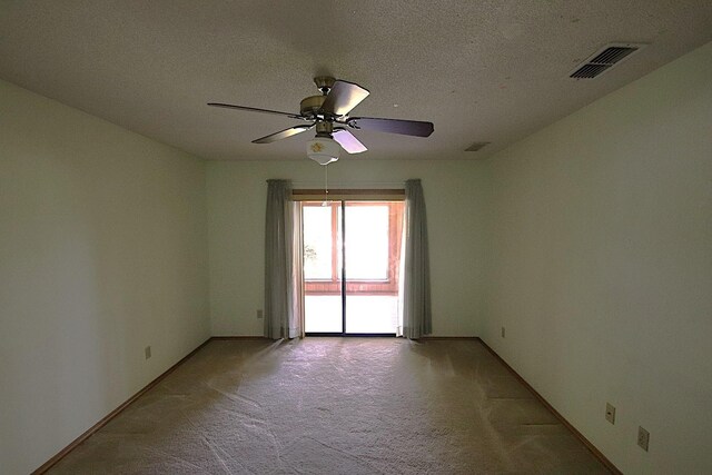 606 County Road 1947, Yantis, TX 75497 - empty room featuring light carpet, ceiling fan, a textured ceiling, and baseboards