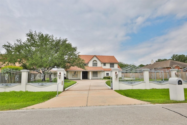 4603 Joyce Blvd, Houston, TX 77084 - view of front of property with driveway, a tiled roof, and stucco siding